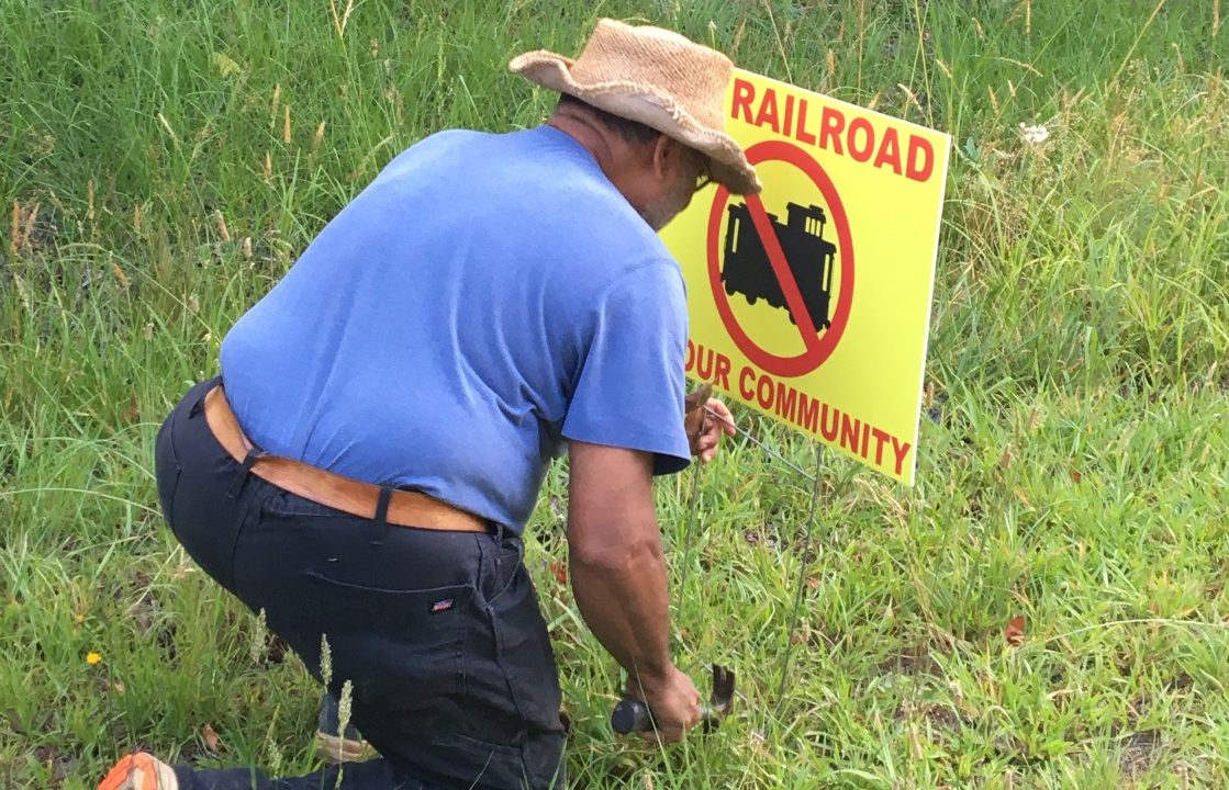 Mark placing Sign - The Commission That Quietly Decided Our Fate